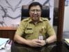 Aliran sungai yang melintasi kawasan Perumahan Bukit Tiara, Desa Pasir Jaya, Kecamatan Cikupa, Kabupaten Tangerang berwarna merah.