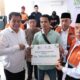 Bupati Maesyal Rasyid mendorong kemandirian ekonomi warga melalui bantuan 80 gerobak usaha dan modal Rp1 juta per penerima.